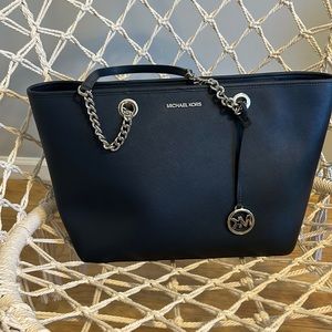 Like New MK navy Tote with silver trim.  Size. 11”x17”
